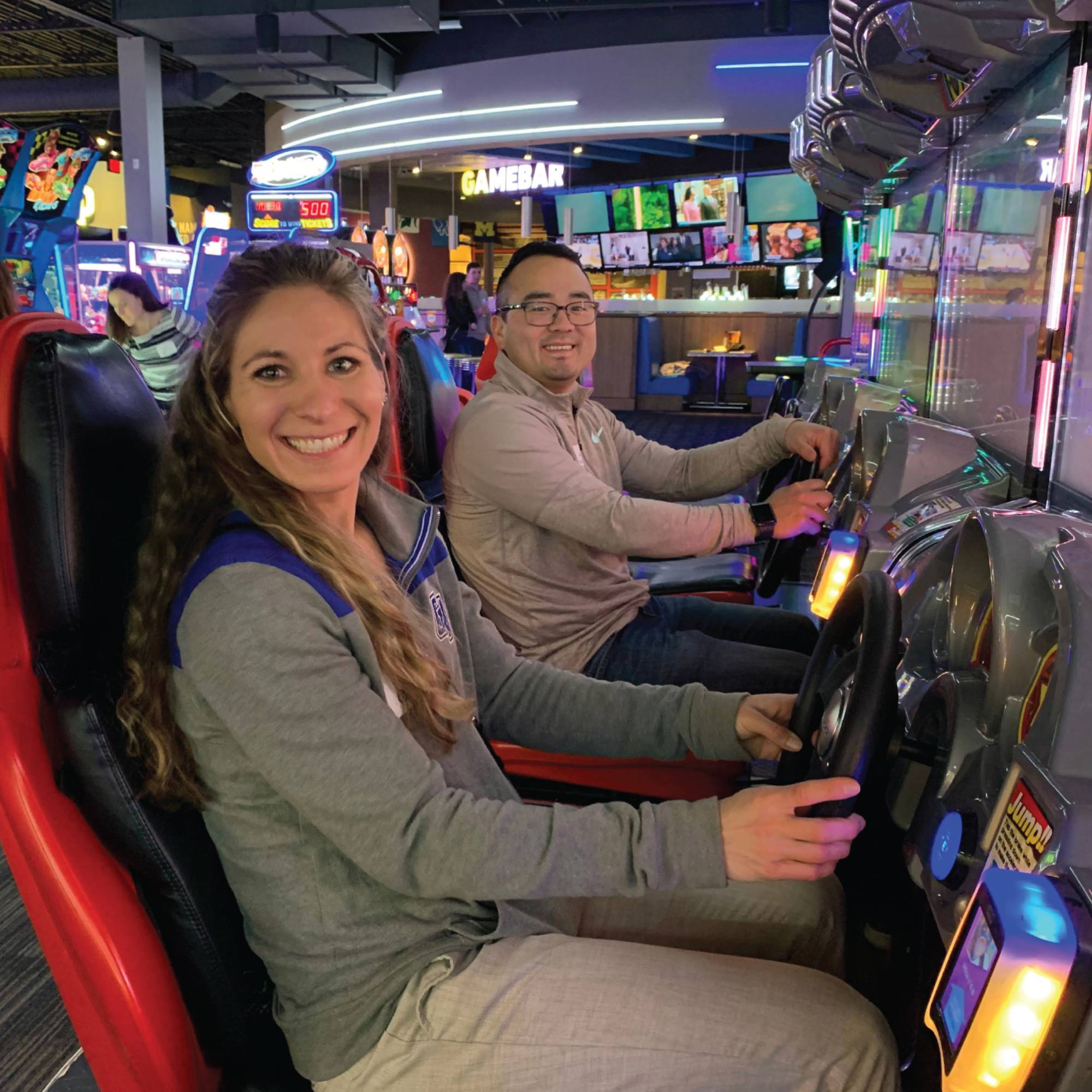 Photo of a couple of Alumni at the dave and busters event.